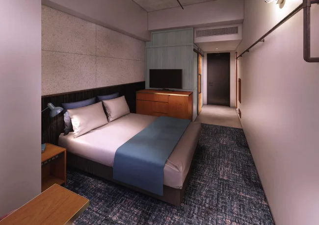 The HOTEL Well-hub Haneda 더블룸의 침대와 책상, 좌석 공간